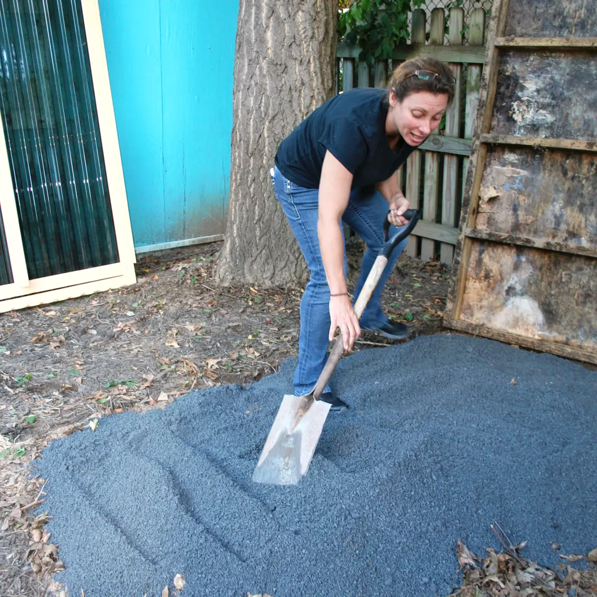 Shoveling gravel for pet shop playhouse.