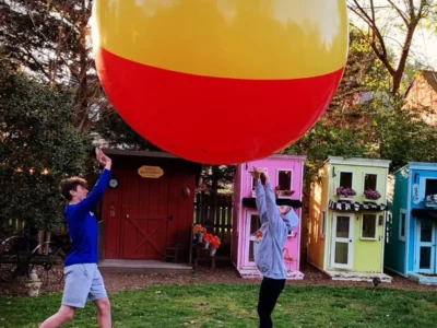 Kids playing with giant ball on Little Main Street