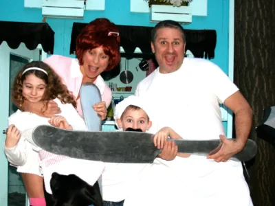 Family goofing off at diner playhouse